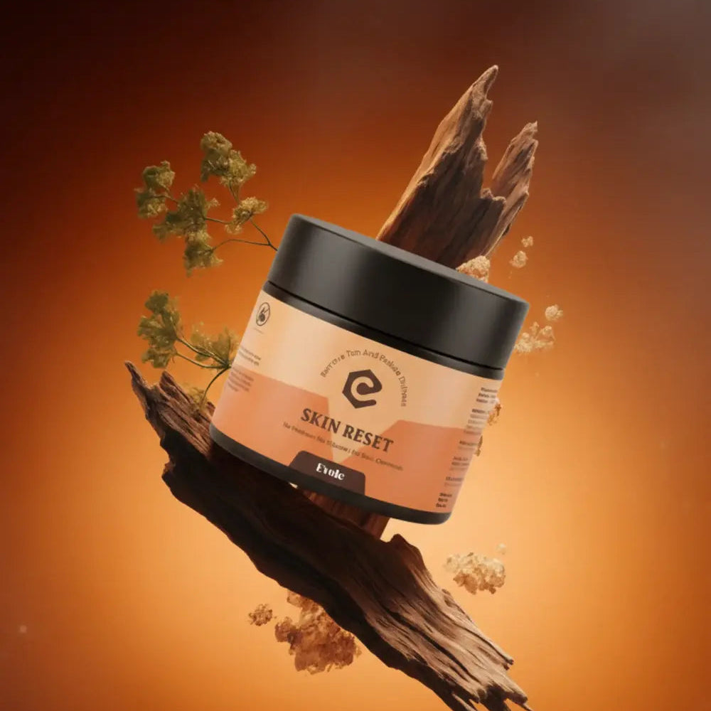 Jar of 'Skin Reset' cream with natural elements on an orange background

